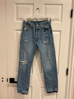 Levi's Women's Straight Jeans in Light Blue with Distressed Details